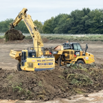 Excavator loading a dump truck